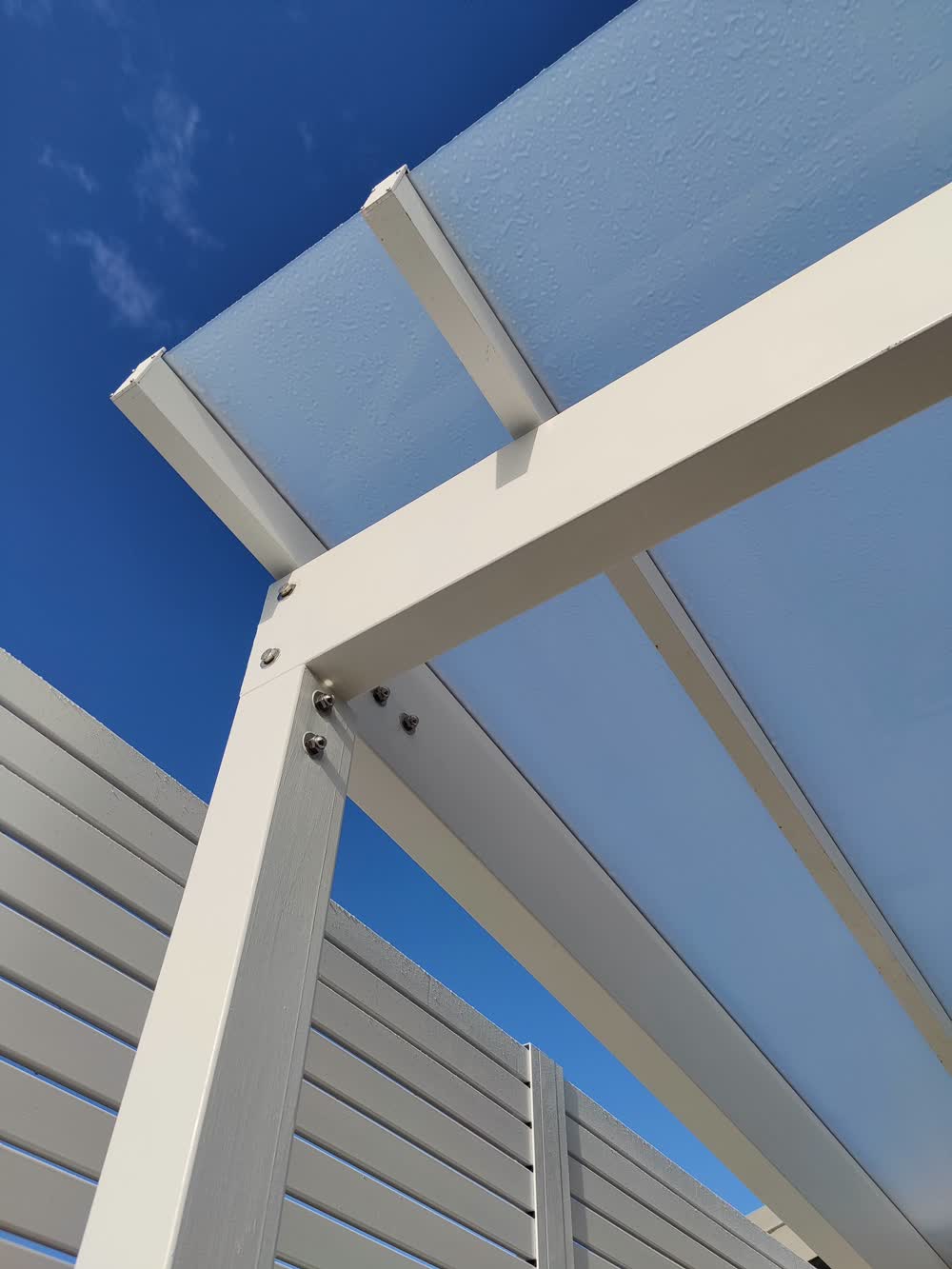 Rain cover corner post on house exterior